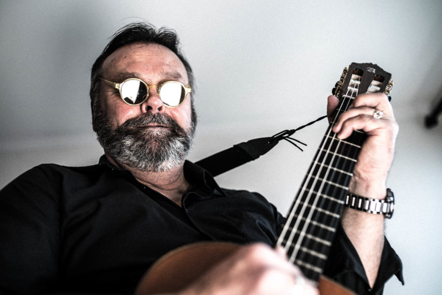 Photograph from first photo session - not quite there yet. Arild with an Alhambra Guitar.